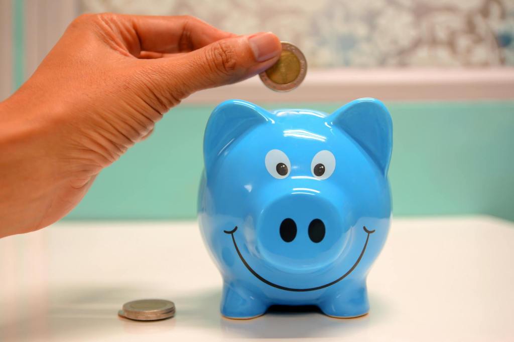 Piggy bank with savings from selling images